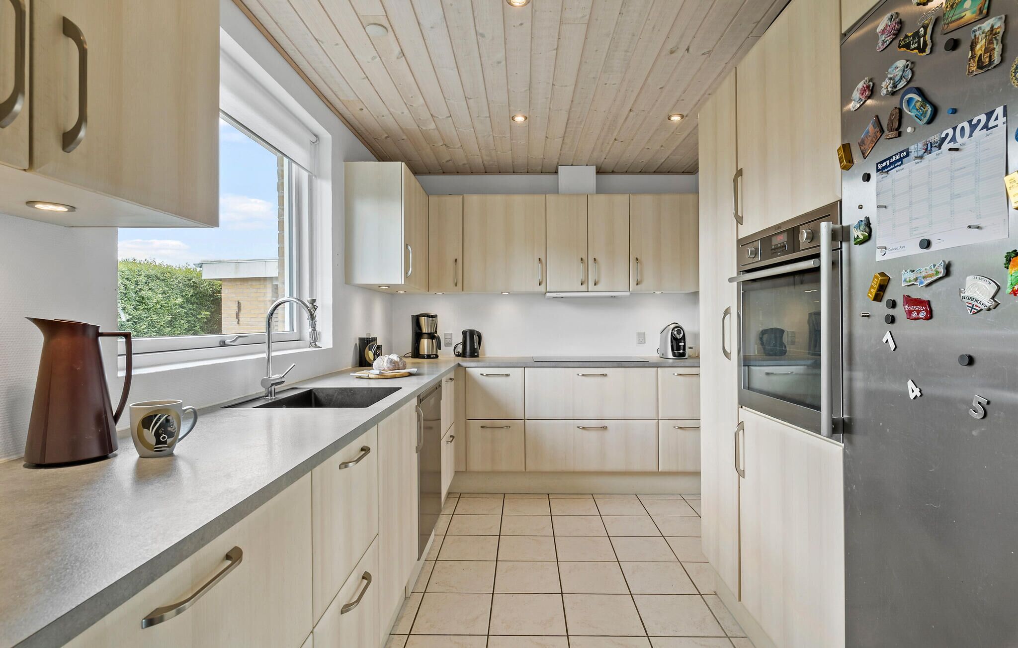 Fridge, stovetop, dishwasher, coffee/tea maker