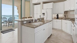 Private kitchen - Beachfront 2BR/2BA condo in Marco Island with waterfront views, pool, WiFi (Marco Island)