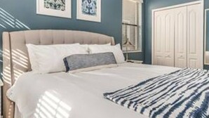 A bedroom with a bed, a nightstand, a dresser, and two framed artworks on the wall. - CG 9025 Shadow Mountain Epic Villa By Disney Theater Game Room Pool Spa (Davenport)