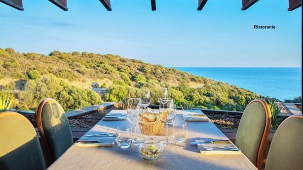 A table set for dining with a view of the sea and hills. - Ecovillage with swimming-pool in Teulada (Teulada)