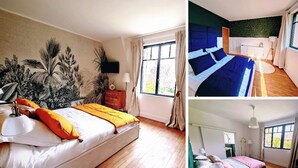A bedroom with a large bed, a window, and a tropical mural. - DOMAINE DE L'ISLE MANIERE APARTMENT 6 PERSONS (near mont saint Michel) (Saint-Quentin-sur-le-Homme)