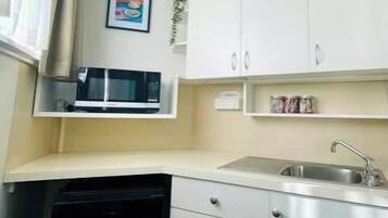 Microwave, toaster, high chair, cookware/dishes/utensils