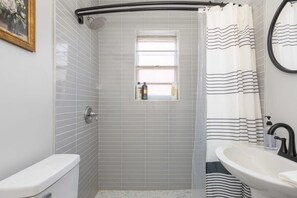 Shower, hair dryer, towels, shampoo