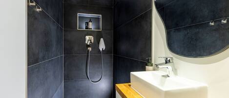 Shower, hair dryer, towels, toilet paper