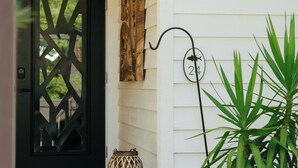 A white house with a black door, a mailbox, and a potted plant. - Grayt Balls of Fire 4 bed, 4 1/2 bath, private pool  Grayton Beach (Santa Rosa Beach)