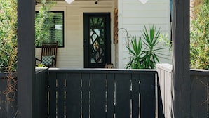A wooden gate leading to a house with a green and white decorative archway above it. - Grayt Balls of Fire 4 bed, 4 1/2 bath, private pool  Grayton Beach (Santa Rosa Beach)