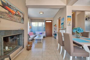 TV, fireplace - Elegant maisonette with Garden, steps to the Beach

 (PF96+P8 Egina, Greece)