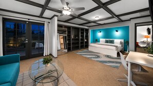 A modern interior with a bed, a dining area, and a glass table. - 30% Off September, Great 4 Families -Pool, Jacuzzi (Palm Springs)