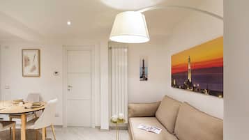 Classic Apartment | Living area | 30-inch TV with satellite channels
