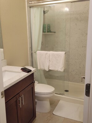 Shower, hair dryer, towels, soap