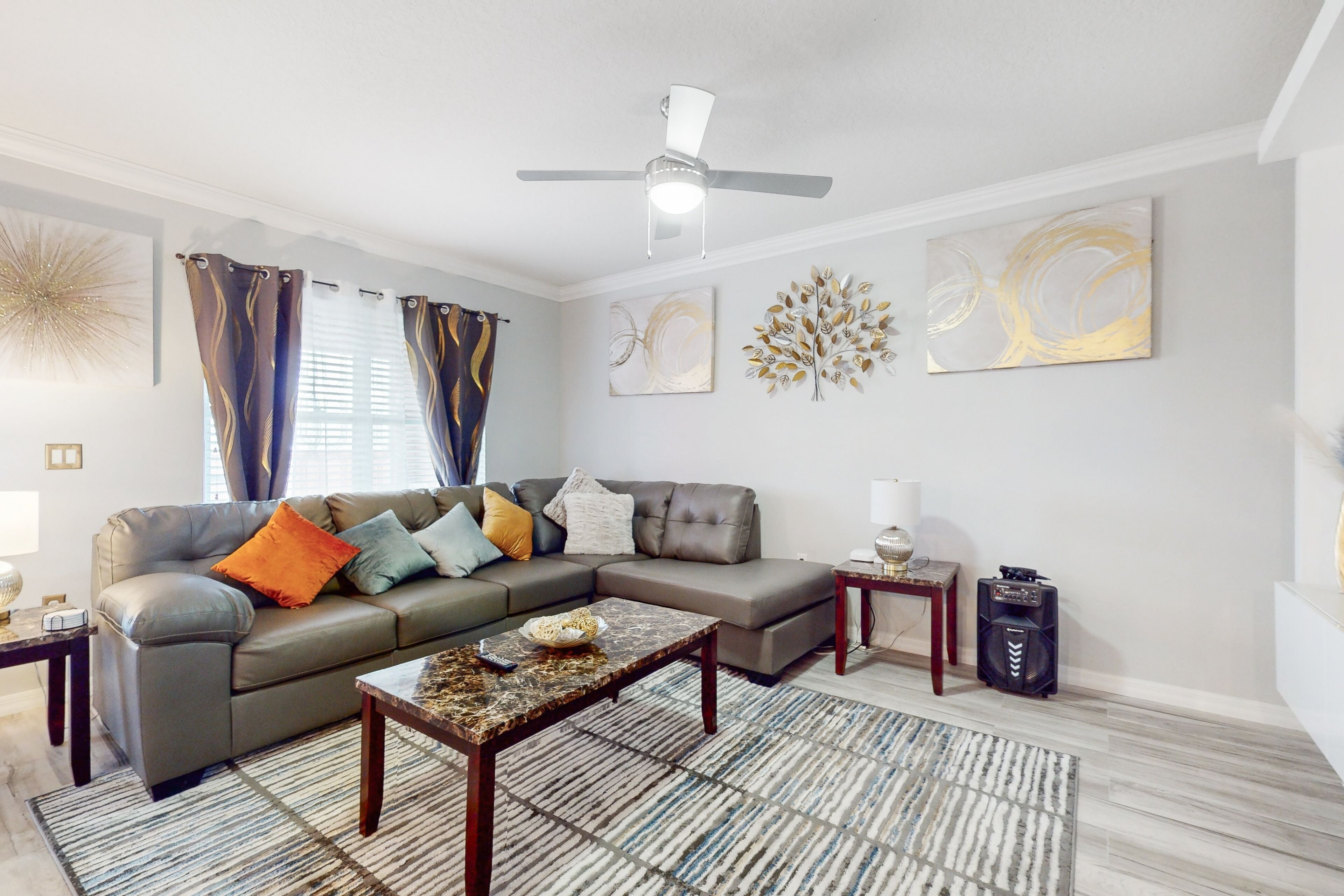 Stylish home near theme parks & golf with sunroom, fenced yard & covered patio