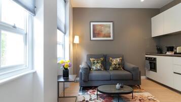 Executive Apartment, Non Smoking, Kitchen | Living area | 40-inch Smart TV with satellite channels