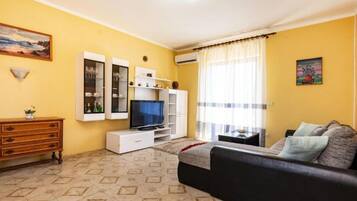 Apartment (Two Bedroom Apartment with Terrace) | Living room | 32-inch flat-screen TV with digital channels
