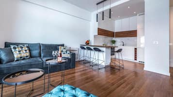 Apartment (One Bedroom Apartment with Balcony) | Living room | Flat-screen TV