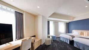 A hotel room with a desk, chair, two beds, a TV, and a small table. - Hotel Keyaki Gate Tokyo Fuchu (Fuchu)