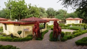 A pathway leading to a building with a sign that reads "SILVER STAR HOTEL." - Design galleries complex (Faridabad)
