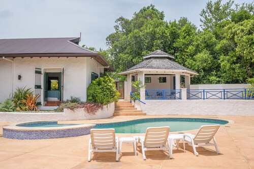 Large deck with views of the Caribbean Sea! Super king beds in luxurious villa.