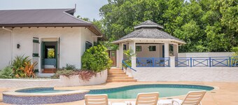 Large deck with views of the Caribbean Sea! Super king beds in luxurious villa.