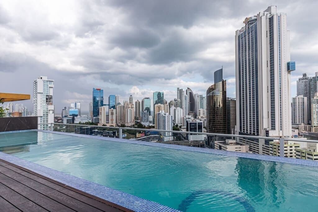 A rooftop pool with a city skyline view.