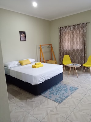 Desk, laptop workspace, iron/ironing board, cribs/infant beds
