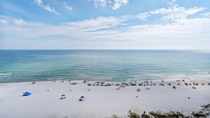 A beach with white sand, clear blue sky, and calm sea. - Summer House 1405a (Orange Beach)
