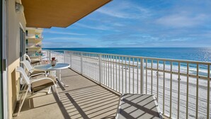 A balcony with a view of the beach, white railings, and outdoor furniture. - Crystal Shores W 301 (Gulf Shores)
