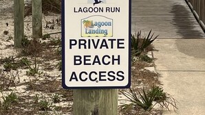 A sign indicating private beach access at Lagoon Landing. - Lagoon Run 105 (Gulf Shores)