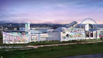 A large entertainment complex with a Ferris wheel, Nickelodeon branding, and DreamWorks logo.