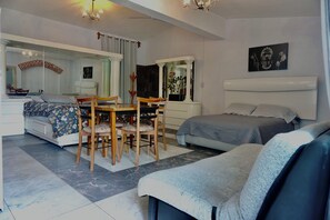 Deluxe Room, Multiple Beds, Smoking, Garden View | Down comforters, free WiFi