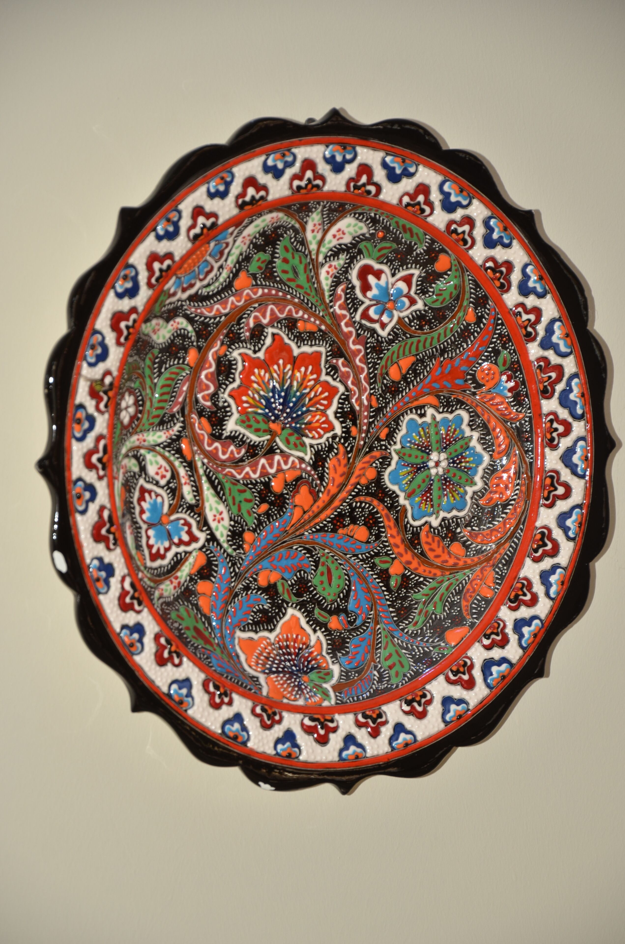 A decorative plate with intricate floral patterns.