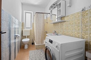 Shower, hair dryer, towels, toilet paper