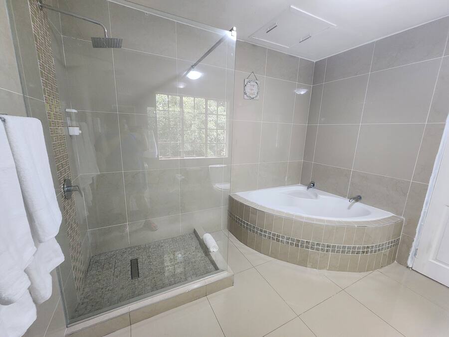 Separate tub and shower, rainfall showerhead, free toiletries