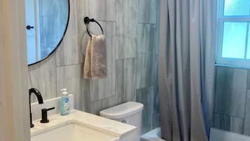 Shower, towels, soap, toilet paper