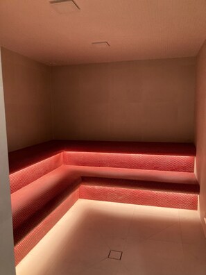 Steps lead to a recessed area in this stylish room.