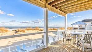 A wooden deck with a view of the beach and dunes. - Pura Vida | Oceanfront | Private Pool, Hot Tub, and Dog Friendly (Virginia Beach)