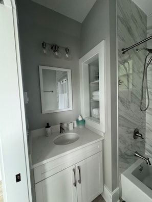 Shower, hair dryer, towels, soap