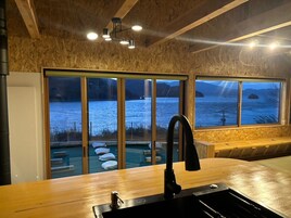 Full-size fridge, microwave, stovetop, coffee/tea maker