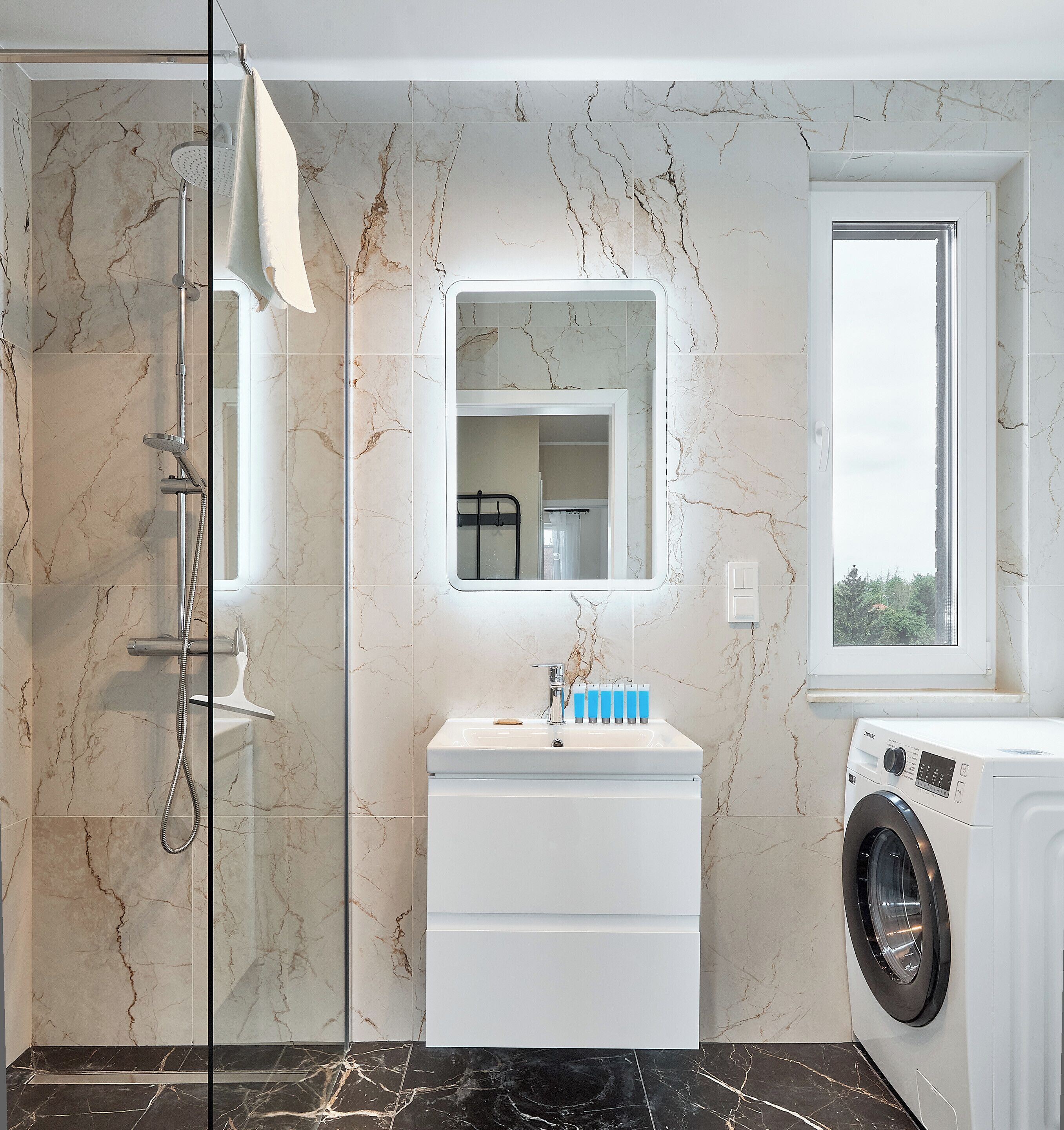 Shower, hair dryer, towels, soap