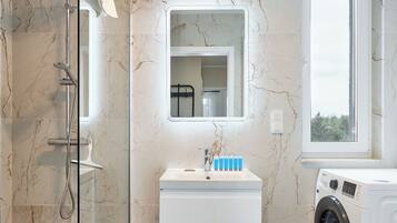 Shower, hair dryer, towels, soap