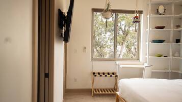 1 bedroom, desk, iron/ironing board, travel crib