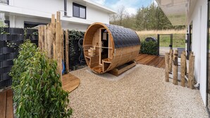 A modern house with a unique sauna built into a wooden barrel structure. - Villa in Zeewolde Near Town Center (Zeewolde)