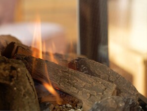 A close-up of burning wood, likely in a fireplace. - Holiday Home Traumstuuv (Varel)