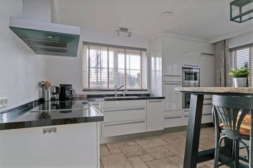 Villa | Private kitchen | Fridge, electric kettle, high chair