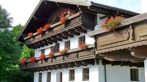 A traditional Alpine-style building with wooden balconies and flower boxes. - Hauzenberg App. 303 (Hauzenberg)
