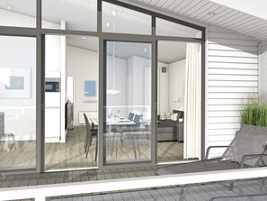 A modern interior with a dining area, kitchen, and living space.