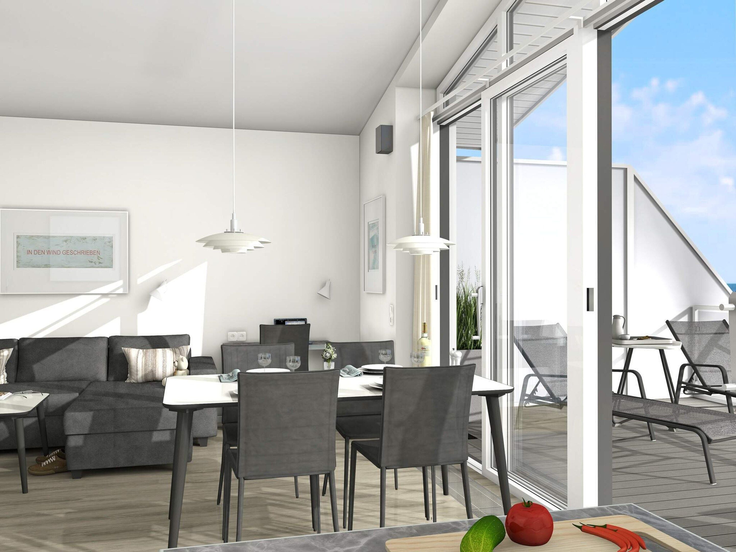 Ein moderner Wohnraum mit Essbereich, einer Couch und einem Tisch mit Schneidebrett und Gemüse.