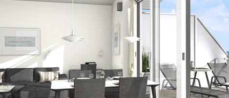 A modern living space with a dining area, a sofa, and a table with a cutting board and vegetables.