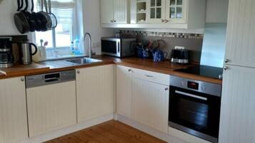 Apartment | Private kitchen | Oven, electric kettle, toaster