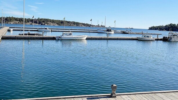 A marina with several boats docked, calm water, and a clear sky. - 6 Person Holiday Home in Vikbolandet-by Traum (Vikbolandet)