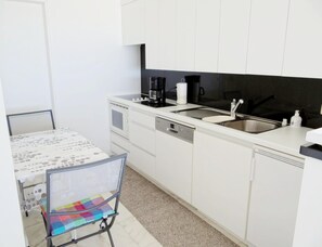 Appartement | Privékeuken | Een kinderstoel